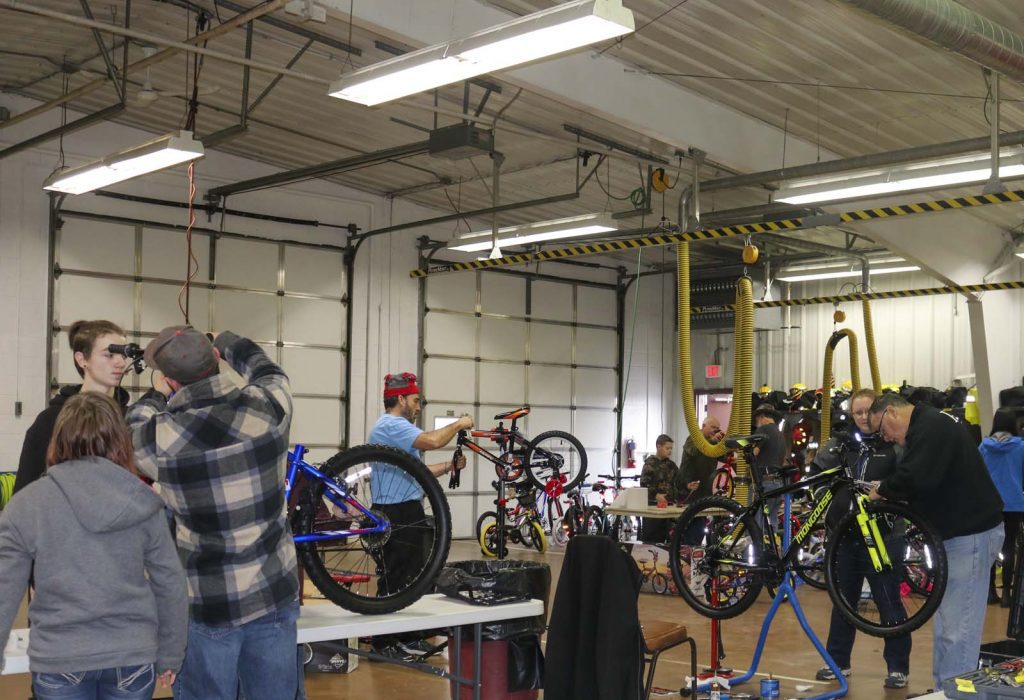 volunteers fixing bikes